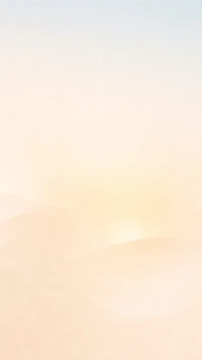 A soft glow over a hazy cream horizon
