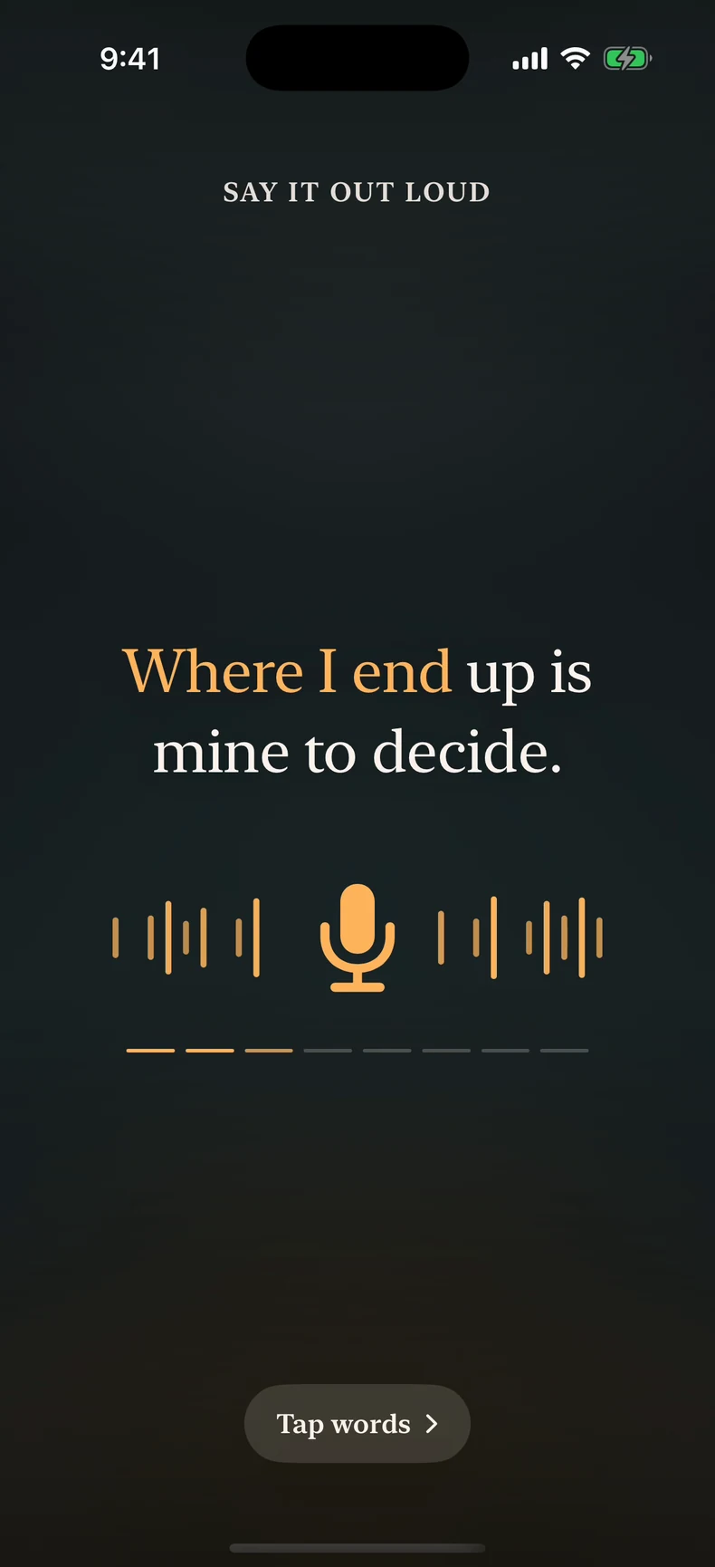 The speak screen: say it out loud, the line Where I end up is mine to decide, with the words already spoken picked out in amber and the microphone listening.